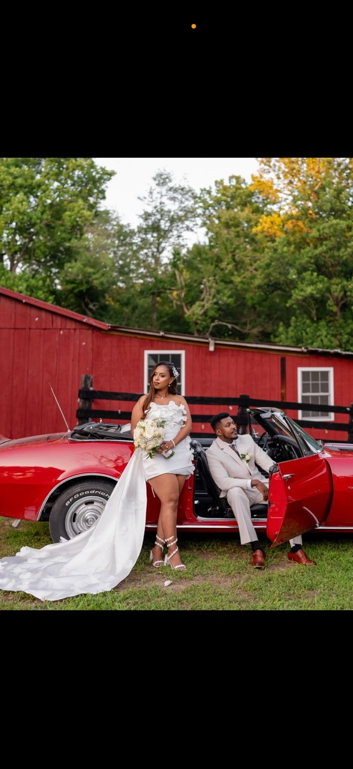 Tariku and Meski by the red car